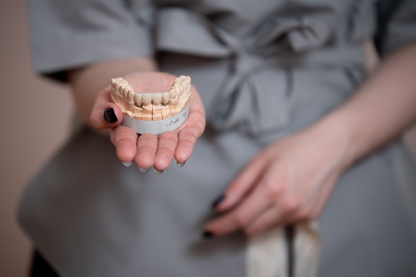 How Prosthodontics, Implants, And Crowns Work Together To Restore Function